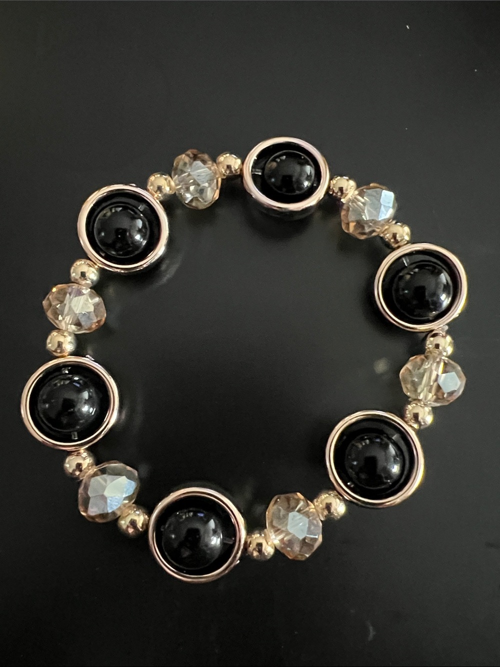 Gold-Tone Black Bead Stretch Bracelet with Faceted Crystal Accents